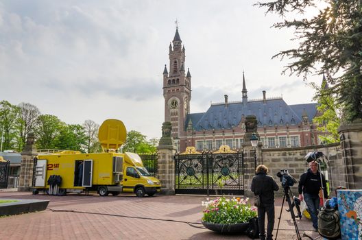 The Hague, Netherlands - May 8, 2015: Reporters at The Peace Palace in The Hague, Netherlands. It is often called the seat of international law because it houses the International Court of Justice.