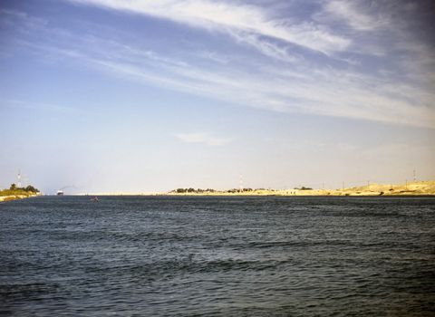 Suez Canal with cargo ship in Egypt