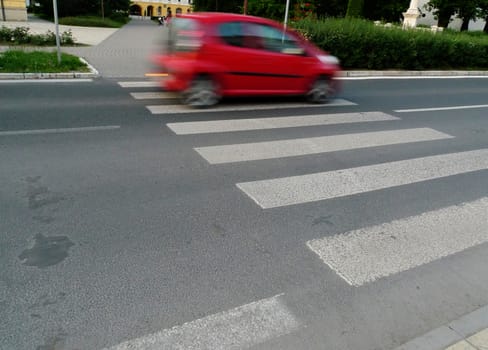 Car in motion on pedestrian zone