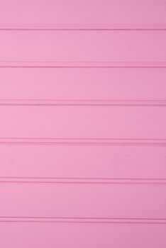 wood texture with pink color background.