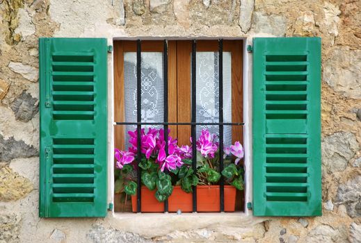 Typical mediterranean window in a house of the village of Deia in Majorca (Spain)