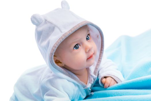 baby in the hood on a blue blanket