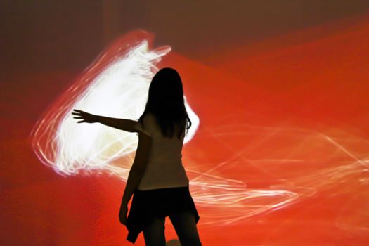 Sao Paulo, Brazil July 5, 2015: Unidentified girl interacting with an electronic artistic work in International fair for electronic language FILE in Sao Paulo Brazil.