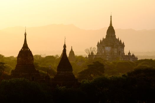 Beautiful sunset scenic view with silhouettes of temples in Bagan, Myanmar (Burma)