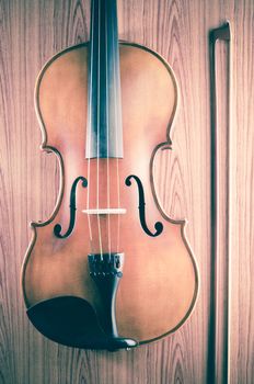 violin on wood background vintage style