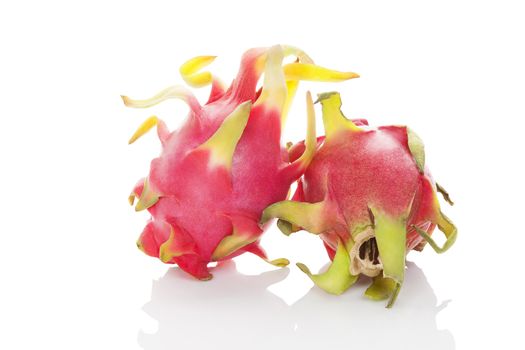 Two whole ripe dragon fruit isolated on white background. Tropical fruit, pitaya concept. Healthy eating. 