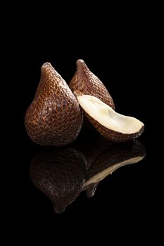 Salak fruit isolated on black background. Tropical asian fruit.