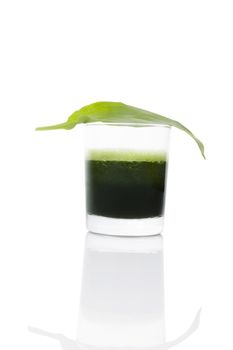 Green juice made from wild garlic with fresh wild garlic leaf isolated on white background. Spring detox, modern minimal style image. 