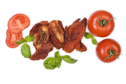 Sundried tomatos, fresh tomatoes and fresh basil herbs isolated on white background, top view. Culinary italian eating.