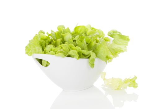 Fresh green salad in white bowl isolated on white background. Fresh healthy summer eating. Culinary arts. Modern minimal image language.