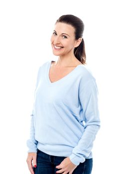 Fashionable woman posing with hands in pockets