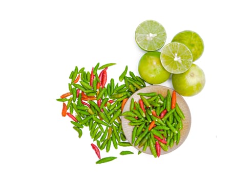 Chili peppers and Limes on white background.