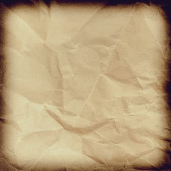 Crumpled paper background vignette space for text or image.Old paper texture