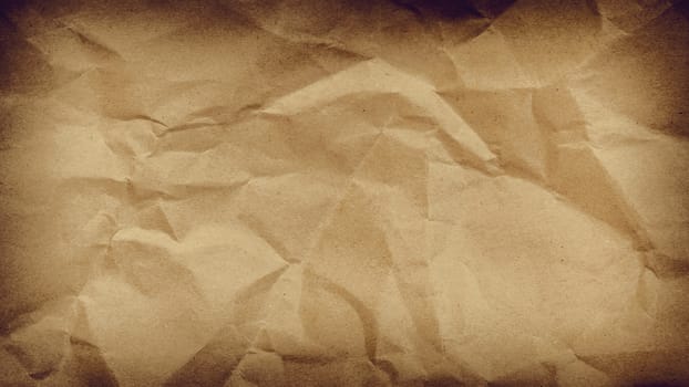Crumpled paper background vignette space for text or image.Old paper texture