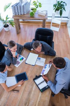 Thoughtful business people during meeting in office