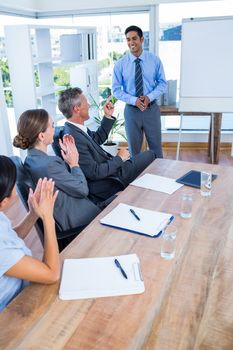 Business people applauding during a meeting in the office