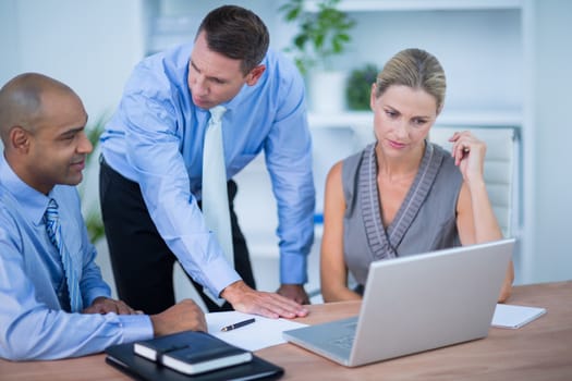 Business partners working on laptop in the office