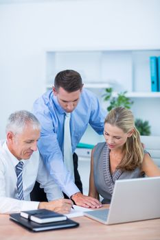 Business partners working on laptop in the office