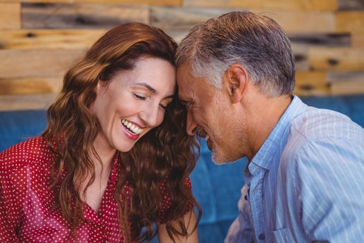 Close up of a couple flirting in a cafe