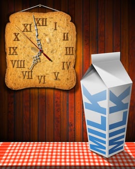 Clock made with a rusk and white packaging of fresh milk with text Milk, on a table with tablecloth and wooden wall