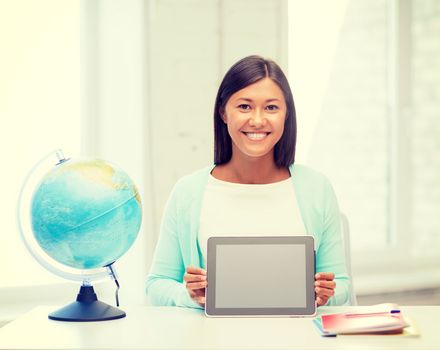 education and school, travel concept - female teacher with globe and tablet pc