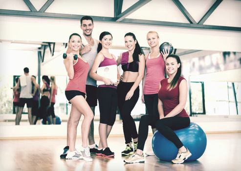 fitness, sport, training, gym and lifestyle concept - group of smiling people in the gym