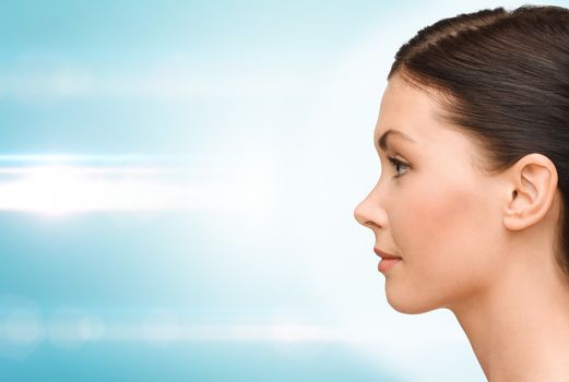 beauty and health concept - profile portrait of young woman