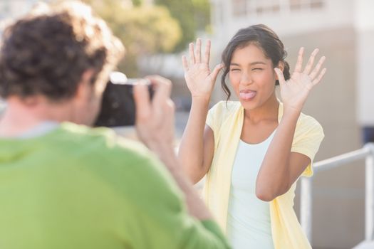 couple taking photos of themselves during the summer