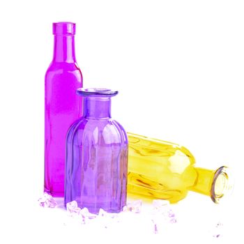 Three colorful bottles, isolated on white background