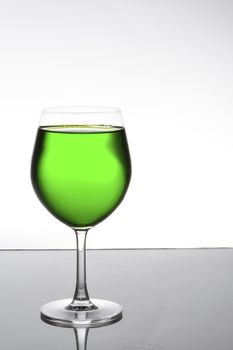 Colorful green juice fruit on champagne glass, still life shooting