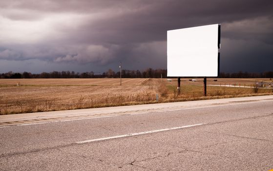 A thuderstorm passes as the billboard advertises nothing