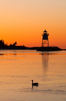 The sun sends a flood orange before passing the horizon