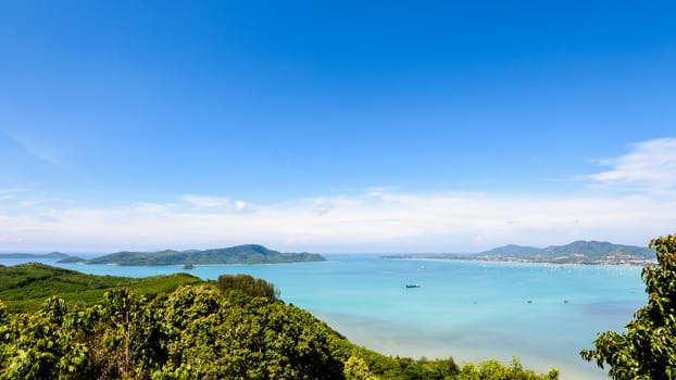 High angle view blue sky over the Andaman Sea and seaside tourist town from Khao-Khad mountain viewpoint famous attractions in Phuket island, Thailand, 16:9 Wide Screen