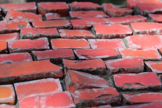 Colored bricks on old fountain.