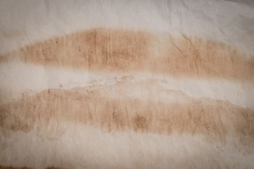 Aged paper texture with stains texture background.
