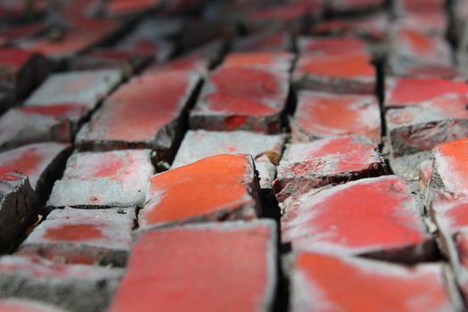 Colored bricks on old fountain.