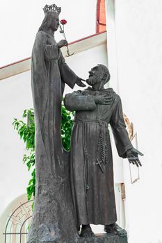 statue of Virgin Mary and Father Pio