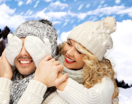 winter holidays, family, vacation and lifestyle concept - family couple in a winter clothes