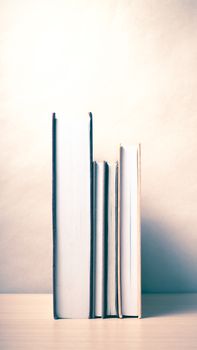 stand up of book on wood table background vintage style