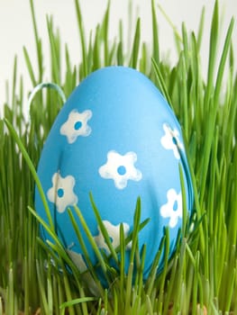 easter egg with white painted flowers