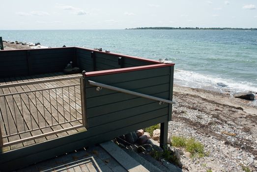 Wooden balcony terrace pf a lovely summer house with great view of the sea ocean