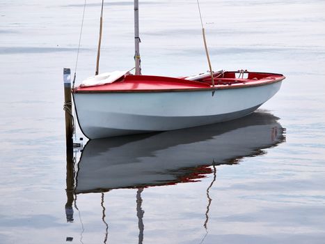 Small sailboat moored at sea great sports activity