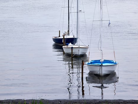 Small sailboats moored at sea great sports activity