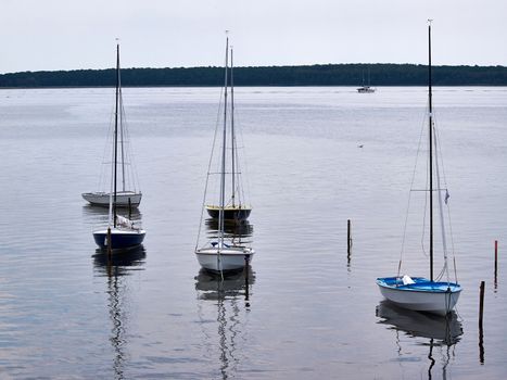 Small sailboats moored at sea great sports activity