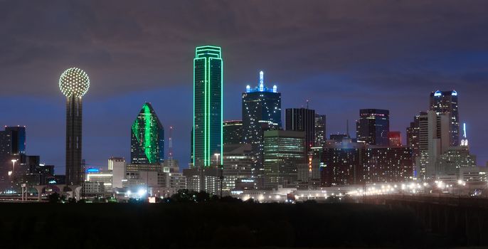 A storm approaches as the natural light fades in Dallas