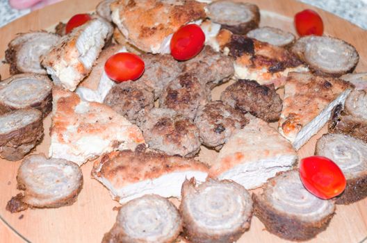 Party, meat plate sausage plate with various meats and vegetables.