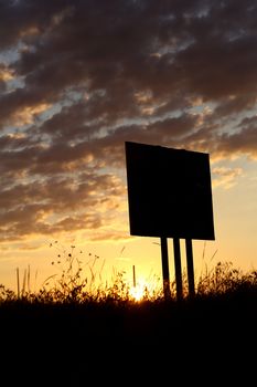 black empty signboard under sunrise sky