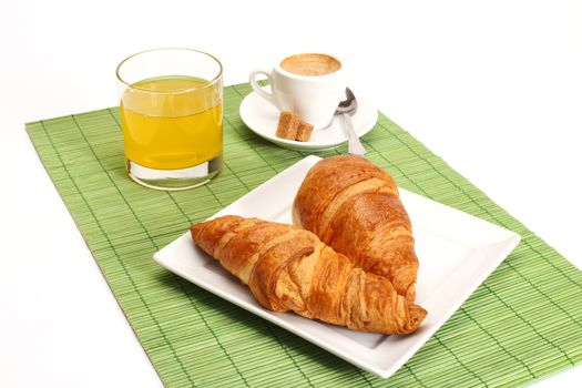 Coffee and croissants close up shallow dof