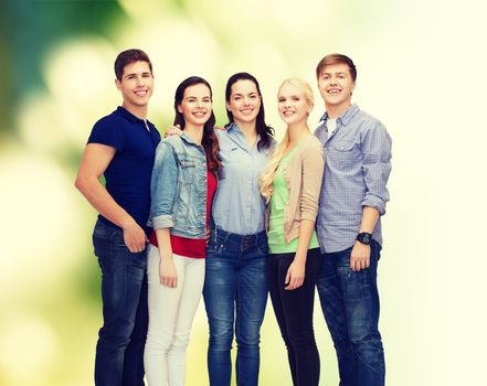 education and people concept - group of smiling students standing