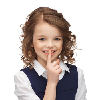 happy children and gestures concept - picture of beautiful pre-teen girl showing hush gesture